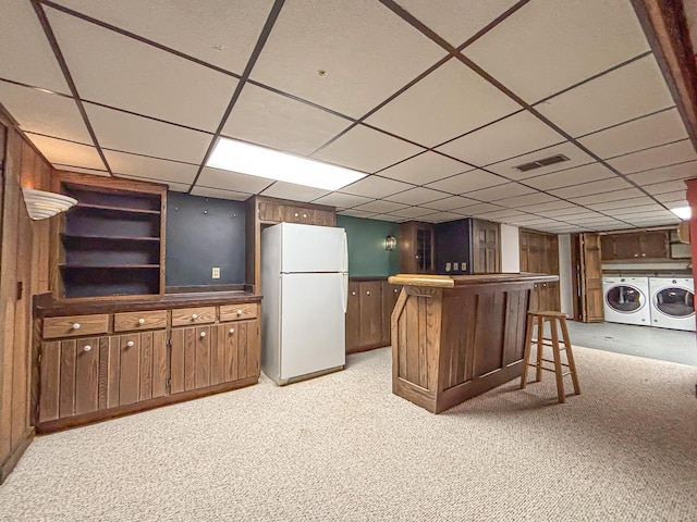 417 Anglesey Rd, Wales, WI 53183 - indoor dry bar featuring freestanding refrigerator, independent washer and dryer, light carpet, and a paneled ceiling