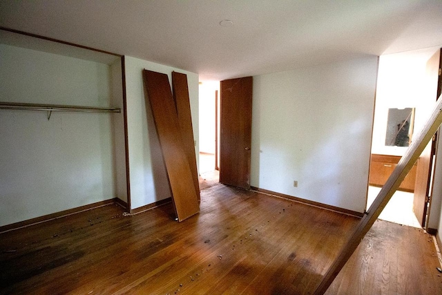 6202 Piping Rock Rd, Madison, WI 53711 - unfurnished bedroom with hardwood / wood-style flooring and a closet