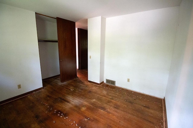 6202 Piping Rock Rd, Madison, WI 53711 - unfurnished bedroom with wood-type flooring and a closet