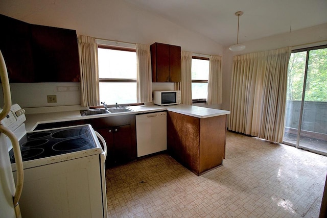 6202 Piping Rock Rd, Madison, WI 53711 - kitchen featuring white appliances, a peninsula, lofted ceiling, light countertops, and decorative light fixtures