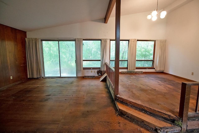 6202 Piping Rock Rd, Madison, WI 53711 - unfurnished living room with lofted ceiling, a chandelier, wooden walls, and a baseboard radiator