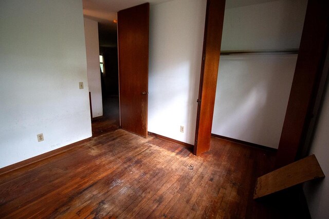 6202 Piping Rock Rd, Madison, WI 53711 - unfurnished bedroom featuring hardwood / wood-style flooring and a closet