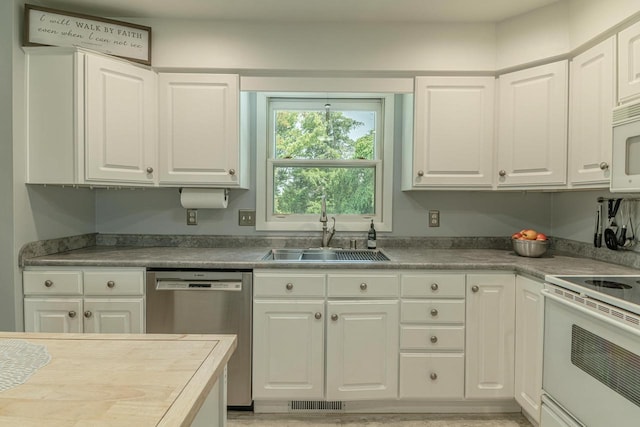 3472 Hickory Hill Rd, Verona, WI 53593 - kitchen with stainless steel dishwasher, white electric range, and white cabinetry