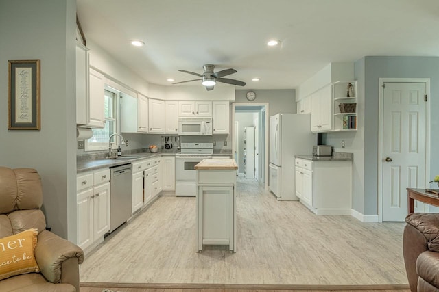 3472 Hickory Hill Rd, Verona, WI 53593 - kitchen featuring white appliances, a kitchen island, open floor plan, white cabinets, and recessed lighting