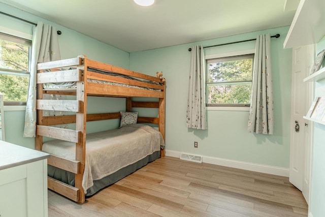 3472 Hickory Hill Rd, Verona, WI 53593 - bedroom featuring light wood finished floors and multiple windows