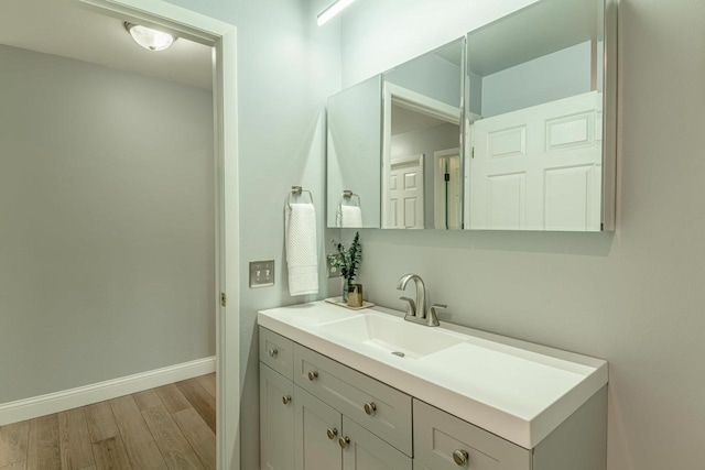 3472 Hickory Hill Rd, Verona, WI 53593 - bathroom with wood finished floors and vanity