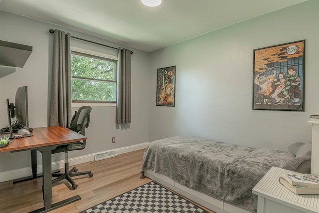 3472 Hickory Hill Rd, Verona, WI 53593 - bedroom with wood finished floors and a desk