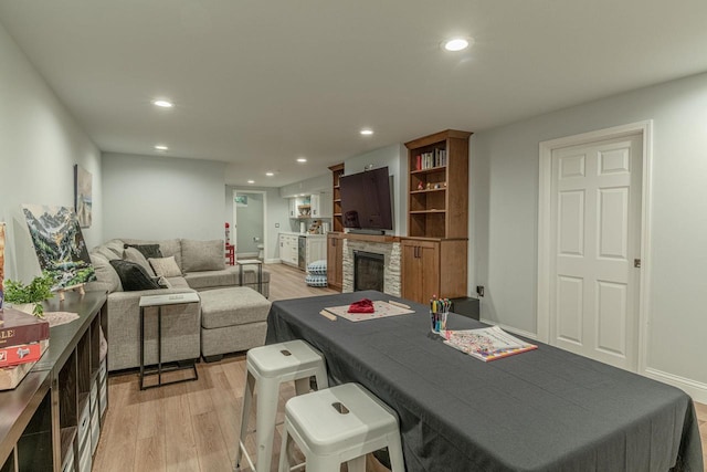 3472 Hickory Hill Rd, Verona, WI 53593 - living area featuring recessed lighting, light wood finished floors, and a stone fireplace