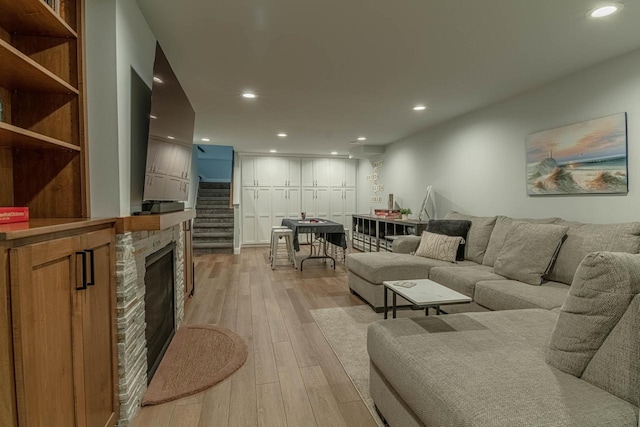 3472 Hickory Hill Rd, Verona, WI 53593 - living area featuring light wood-type flooring, recessed lighting, a fireplace, and stairway