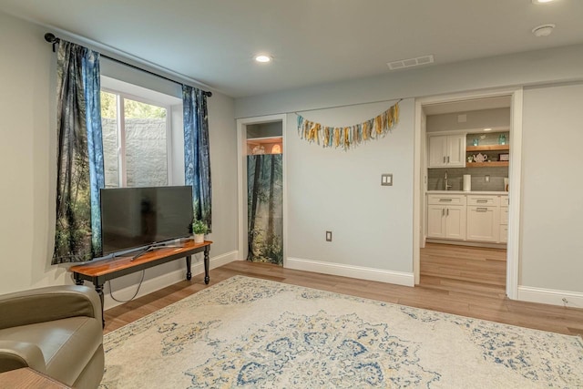 3472 Hickory Hill Rd, Verona, WI 53593 - sitting room with light wood-style floors and recessed lighting