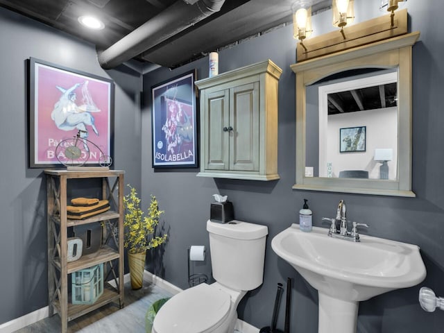 3605 Emmertsen Rd, Racine, WI 53406 - bathroom with baseboards and wood finished floors