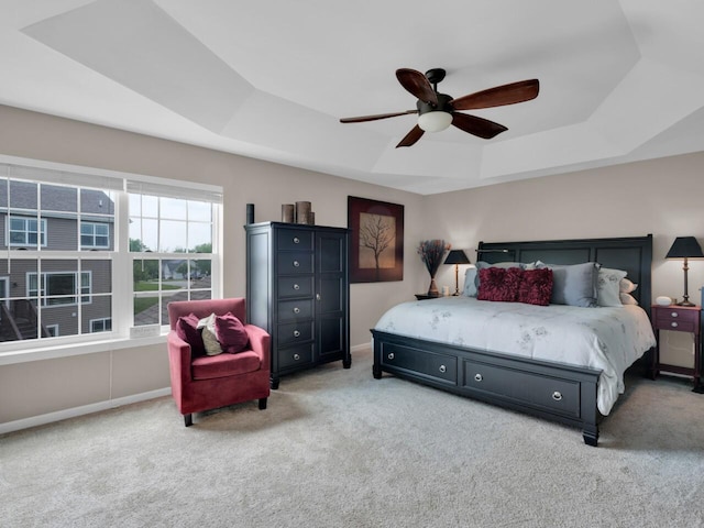 3605 Emmertsen Rd, Racine, WI 53406 - bedroom featuring a tray ceiling, carpet flooring, and ceiling fan