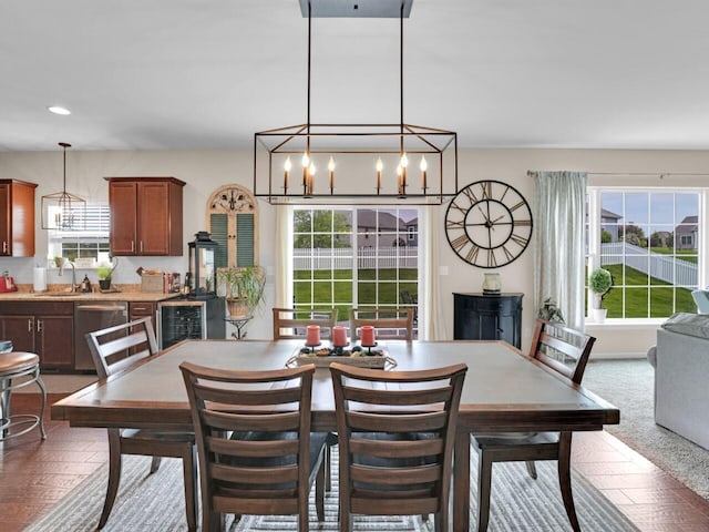 3605 Emmertsen Rd, Racine, WI 53406 - carpeted dining room with plenty of natural light, a chandelier, beverage cooler, and recessed lighting