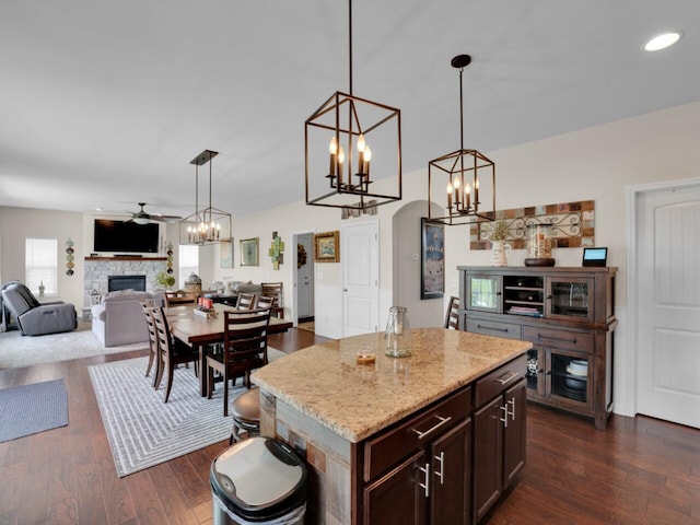 3605 Emmertsen Rd, Racine, WI 53406 - kitchen with a ceiling fan, a chandelier, a fireplace, open floor plan, and decorative light fixtures