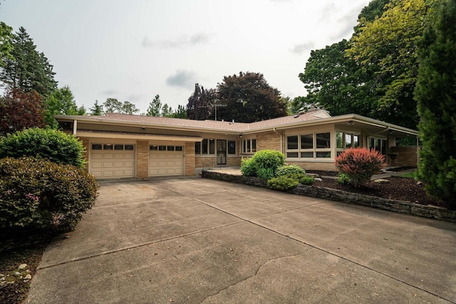 3358 Taylor Ave, Elmwood Park, WI 53405 - view of front of property featuring an attached garage, driveway, and brick siding