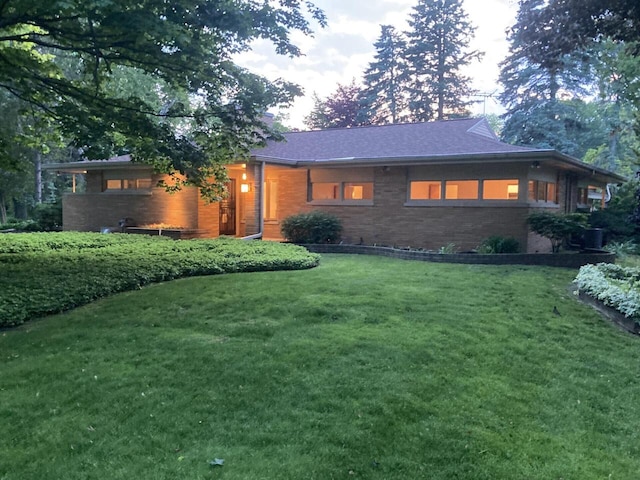 3358 Taylor Ave, Elmwood Park, WI 53405 - view of front of property featuring brick siding and a lawn