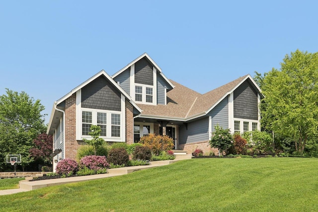 N60W13464 Tall Oak Ct, Menomonee Falls, WI 53051 - view of front of home with a front yard and brick siding