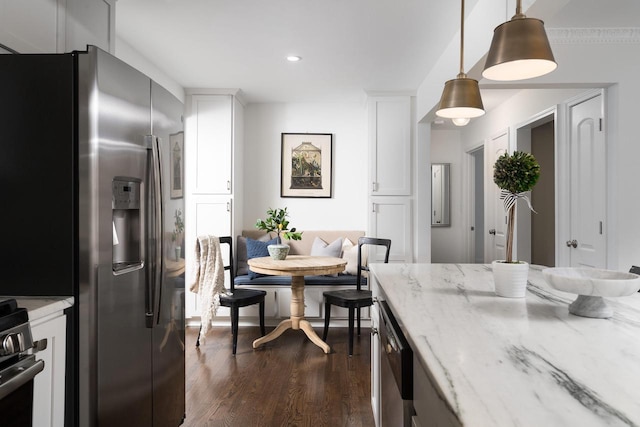 2461 N 94th St, Wauwatosa, WI 53226 - kitchen with appliances with stainless steel finishes, dark wood-style floors, white cabinets, pendant lighting, and recessed lighting