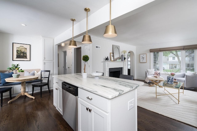 2461 N 94th St, Wauwatosa, WI 53226 - kitchen featuring open floor plan, dishwasher, a fireplace, white cabinets, and light stone counters
