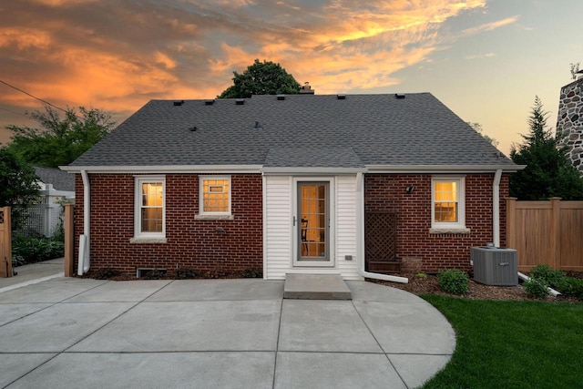 2461 N 94th St, Wauwatosa, WI 53226 - rear view of property with brick siding, a patio, and roof with shingles