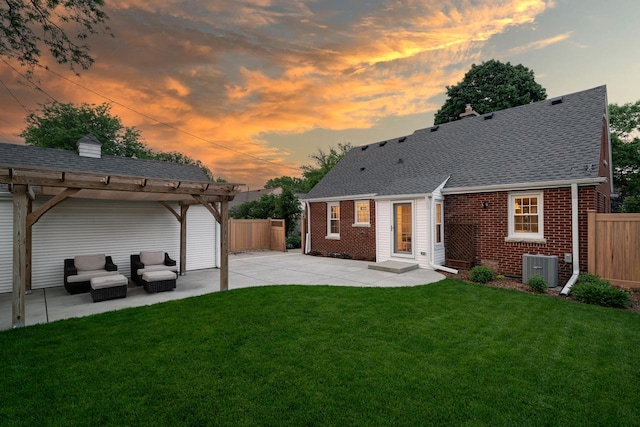 2461 N 94th St, Wauwatosa, WI 53226 - back of house featuring brick siding, a patio, a pergola, an outdoor living space, and roof with shingles