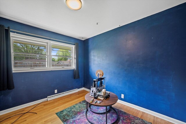3351 W Vogel Ave, Greenfield, WI 53221 - sitting room featuring baseboard heating and wood finished floors