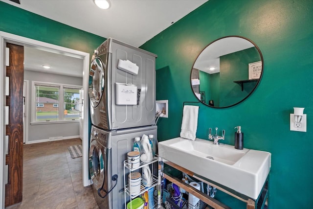 3351 W Vogel Ave, Greenfield, WI 53221 - bathroom featuring stacked washer and clothes dryer, tile patterned floors, vanity, and recessed lighting
