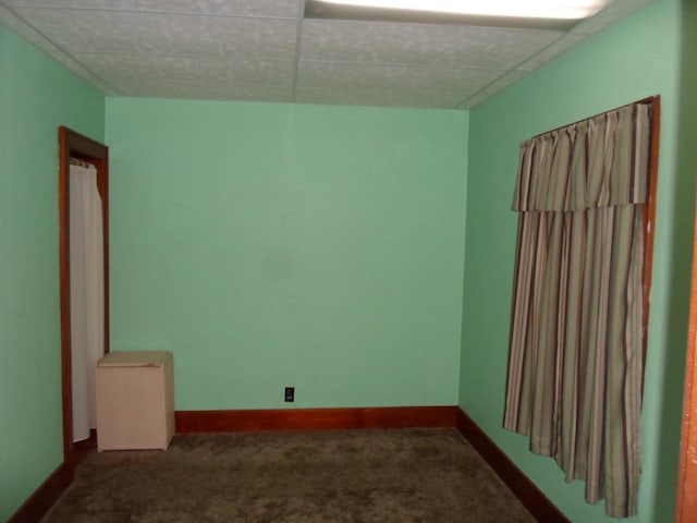 212 E Bowen St, Brandon, WI 53919 - spare room with dark carpet and a drop ceiling