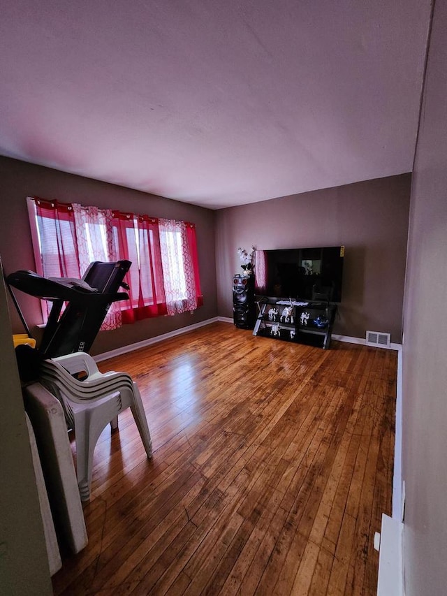 1535 W Lincoln Ave, Milwaukee, WI 53215 - exercise room with wood-type flooring and baseboards