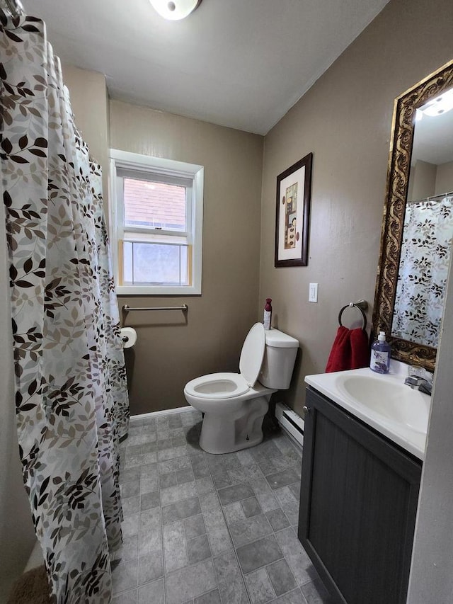 1535 W Lincoln Ave, Milwaukee, WI 53215 - full bathroom featuring a baseboard heating unit and vanity