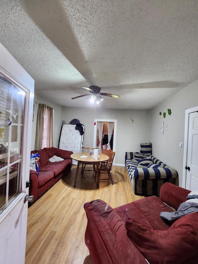 1535 W Lincoln Ave, Milwaukee, WI 53215 - living room with a textured ceiling, wood finished floors, and ceiling fan