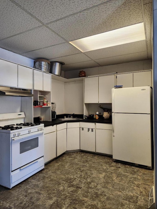1535 W Lincoln Ave, Milwaukee, WI 53215 - kitchen featuring white appliances, a paneled ceiling, white cabinets, open shelves, and dark countertops
