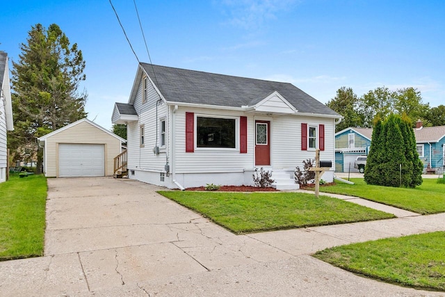 2717 13th St, Two Rivers, WI 54241 - bungalow with a garage, an outbuilding, concrete driveway, and a front yard