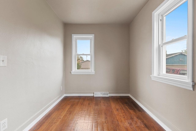2717 13th St, Two Rivers, WI 54241 - empty room with dark wood-style floors and baseboards