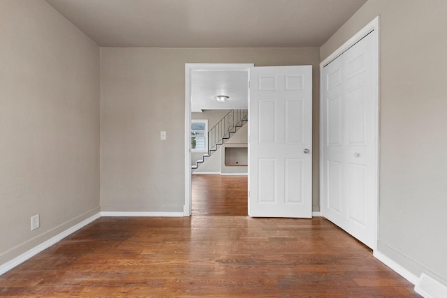 2717 13th St, Two Rivers, WI 54241 - spare room with wood finished floors and stairs