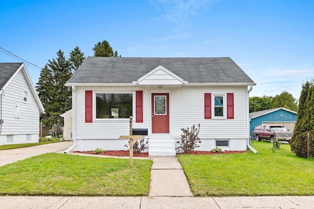 2717 13th St, Two Rivers, WI 54241 - bungalow-style house with a front lawn and roof with shingles