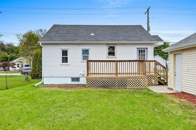 2717 13th St, Two Rivers, WI 54241 - back of house with a yard, a deck, and roof with shingles