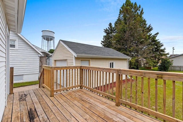 2717 13th St, Two Rivers, WI 54241 - wooden terrace with a detached garage and an outbuilding