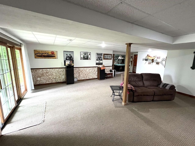 2783 High Peak Rd, Rhinelander, WI 54501 - carpeted living room with a drop ceiling, ornate columns, and wainscoting