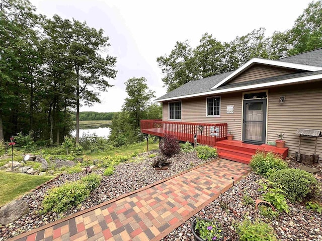 2783 High Peak Rd, Rhinelander, WI 54501 - rear view of property featuring a deck with water view and a shingled roof