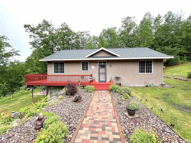 2783 High Peak Rd, Rhinelander, WI 54501 - ranch-style home with a wooden deck, a front yard, and roof with shingles