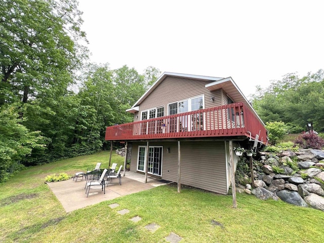 2783 High Peak Rd, Rhinelander, WI 54501 - back of property with a yard, a wooden deck, and a patio