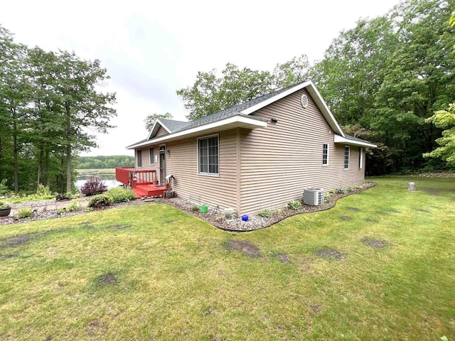 2783 High Peak Rd, Rhinelander, WI 54501 - view of side of property with a lawn and a central AC unit