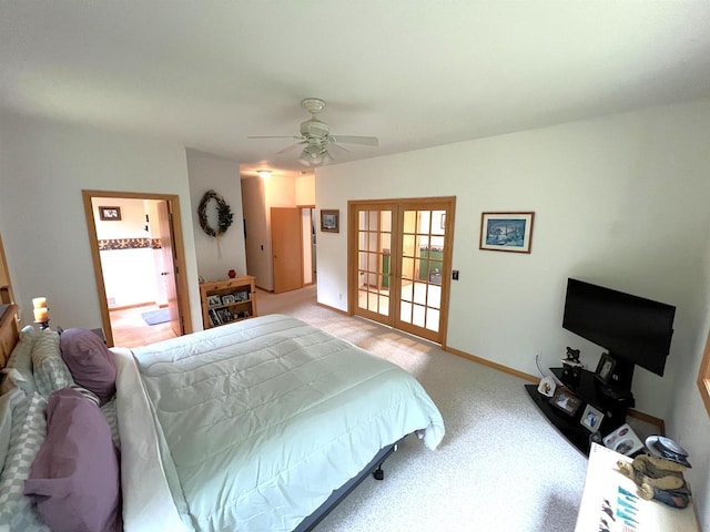 2783 High Peak Rd, Rhinelander, WI 54501 - carpeted bedroom featuring french doors, a ceiling fan, and connected bathroom