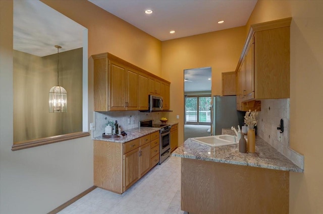 3 Deer Point Trl, Madison, WI 53719 - kitchen featuring stainless steel appliances, backsplash, light stone counters, light floors, and a chandelier