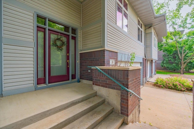 3 Deer Point Trl, Madison, WI 53719 - property entrance featuring brick siding, a garage, and concrete driveway