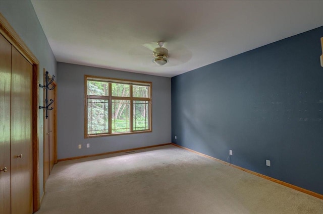 3 Deer Point Trl, Madison, WI 53719 - unfurnished bedroom featuring light colored carpet, a closet, and a ceiling fan