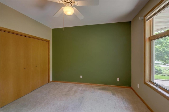 3 Deer Point Trl, Madison, WI 53719 - unfurnished bedroom with light carpet, a closet, and a ceiling fan