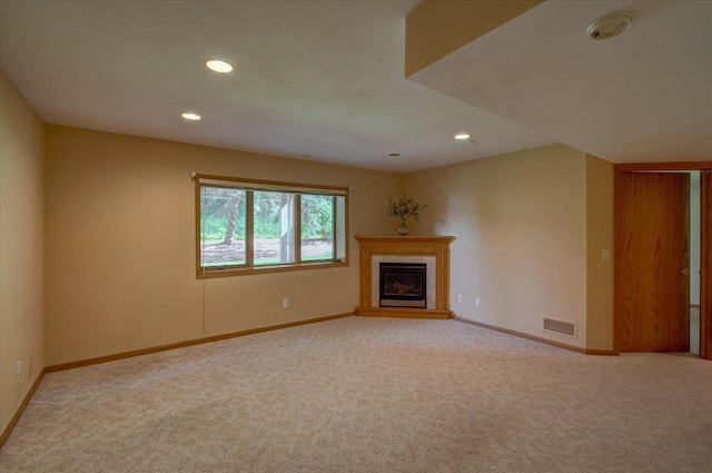 3 Deer Point Trl, Madison, WI 53719 - unfurnished living room featuring carpet floors, recessed lighting, and a tile fireplace