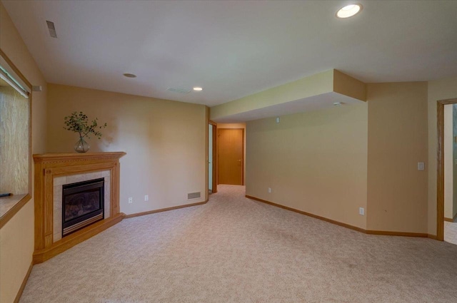 3 Deer Point Trl, Madison, WI 53719 - unfurnished living room with light colored carpet, a tile fireplace, and recessed lighting